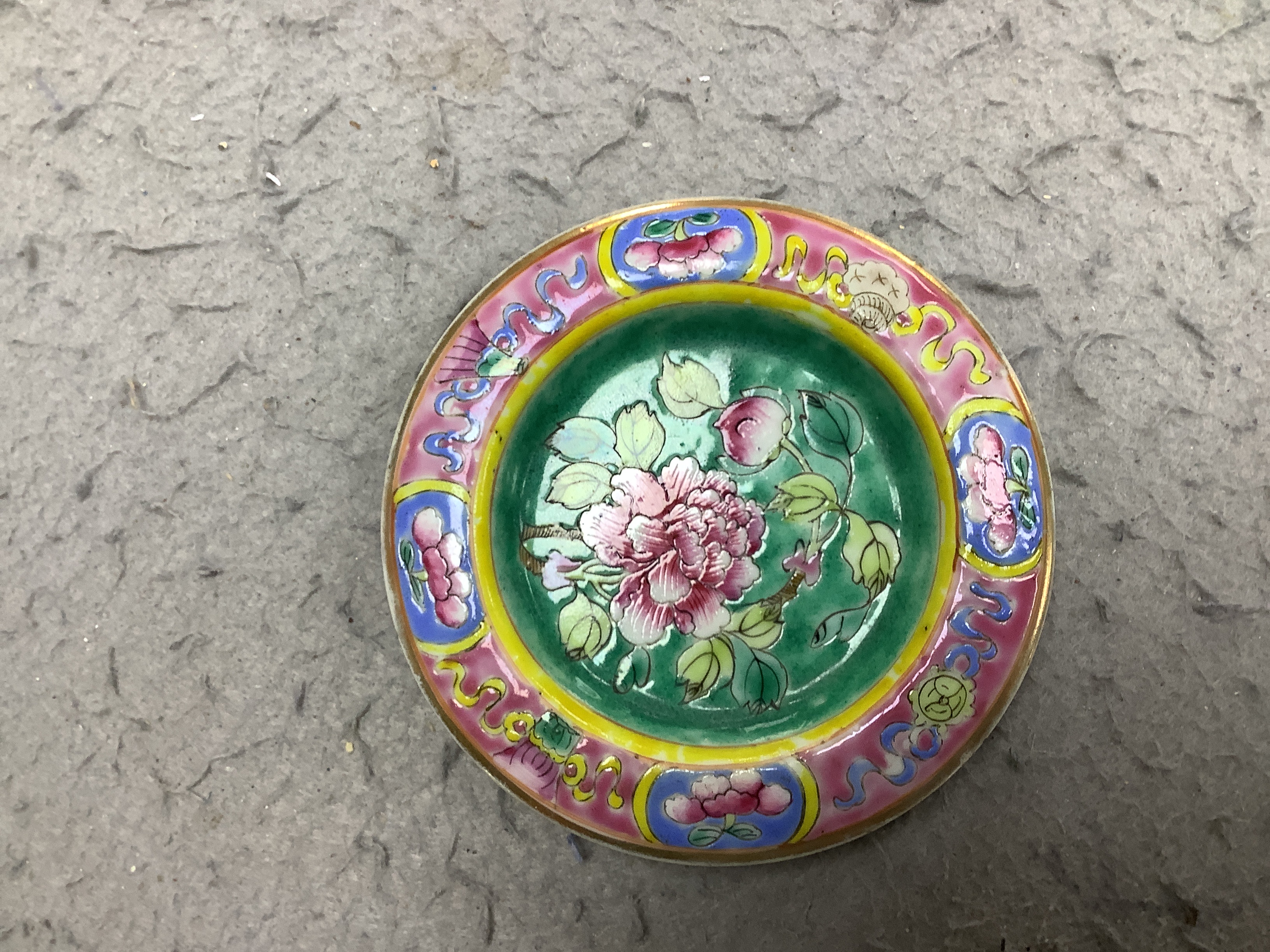 A Chinese Straits enamelled porcelain teapot and cover and seven similar tea bowls, Guangxu period and a pillow, teapot 18cm high including cover